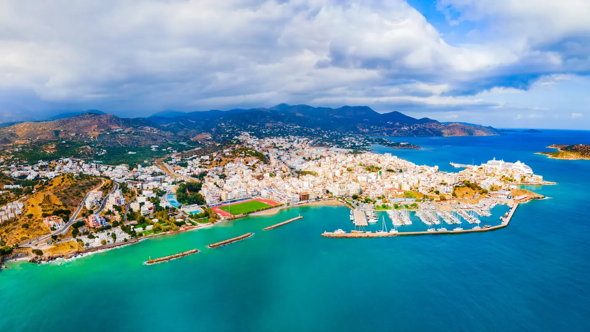 Agios Nikolaos harbor aerial panoramic view. Agios, Hagios or Aghios Nikolaos is a coastal city on the island of Crete in Greece.
