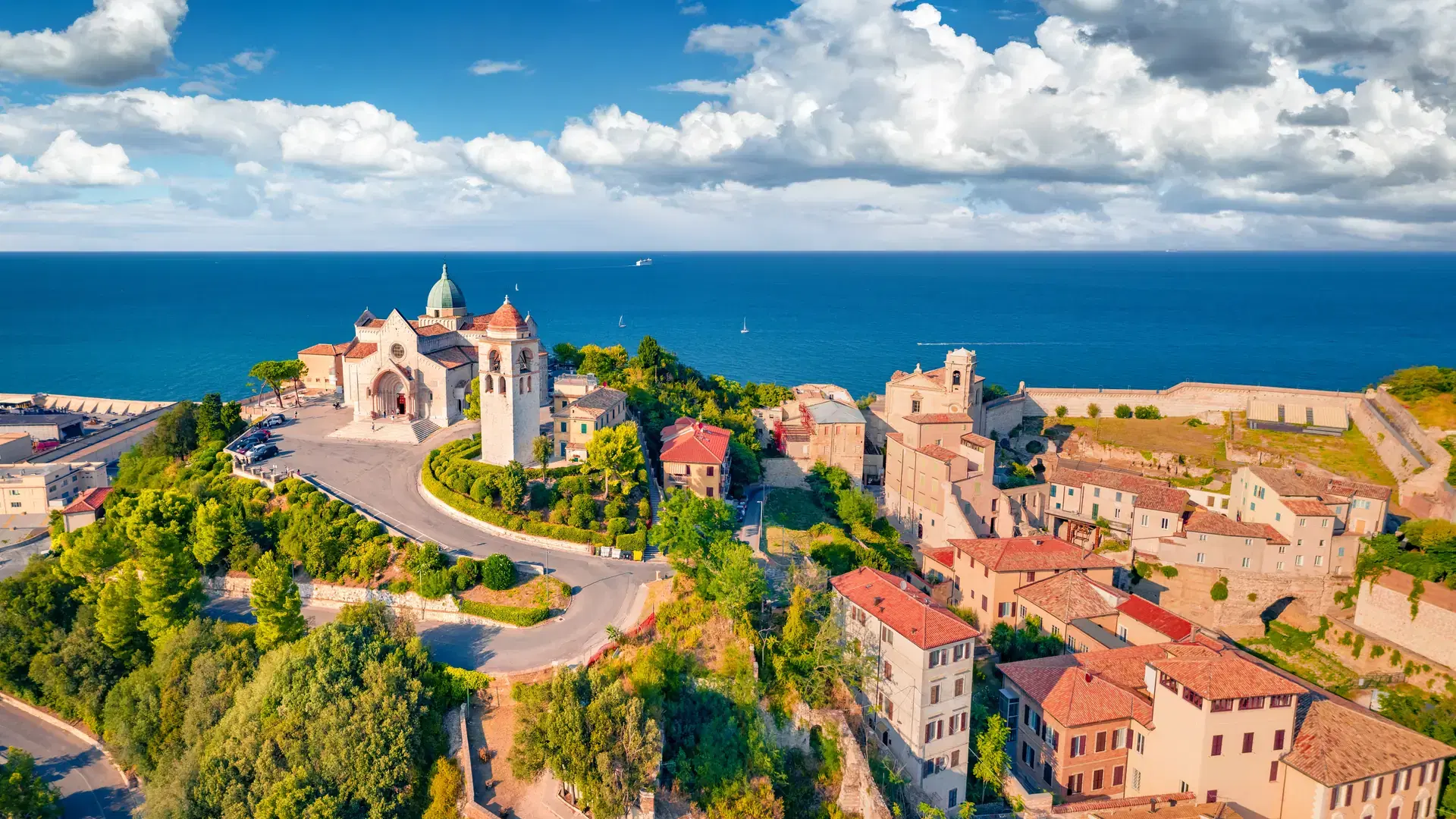 Bright summer view from flying drone of Cattedrale di San Ciriaco church and San Gregorio Illuminatore - Catholic church. Stunning morning cityscape of Ancona town, Italy, Europe.