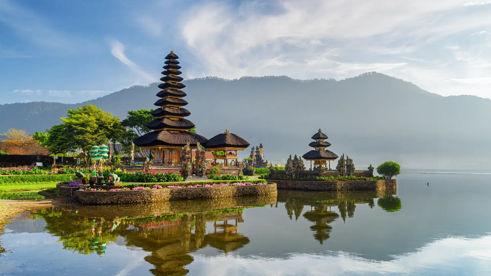 Awesome view of Pura Ulun Danu Beratan (Pura Bratan) in Bali, Indonesia. Amazing Hindu Shaivite temple reflected in water of Lake Beratan. The temple complex is a popular tourist attraction of Asia.