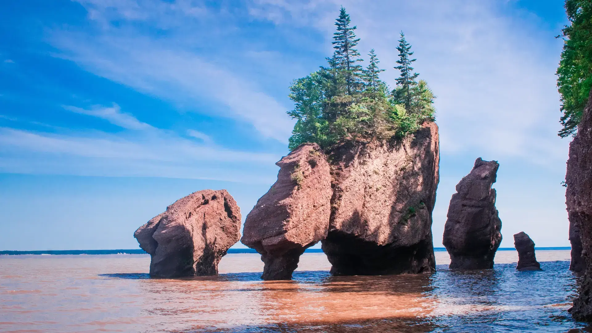 A scenic view of Hopewell Rocks in the Bay of Fundy, Canada on daytime
