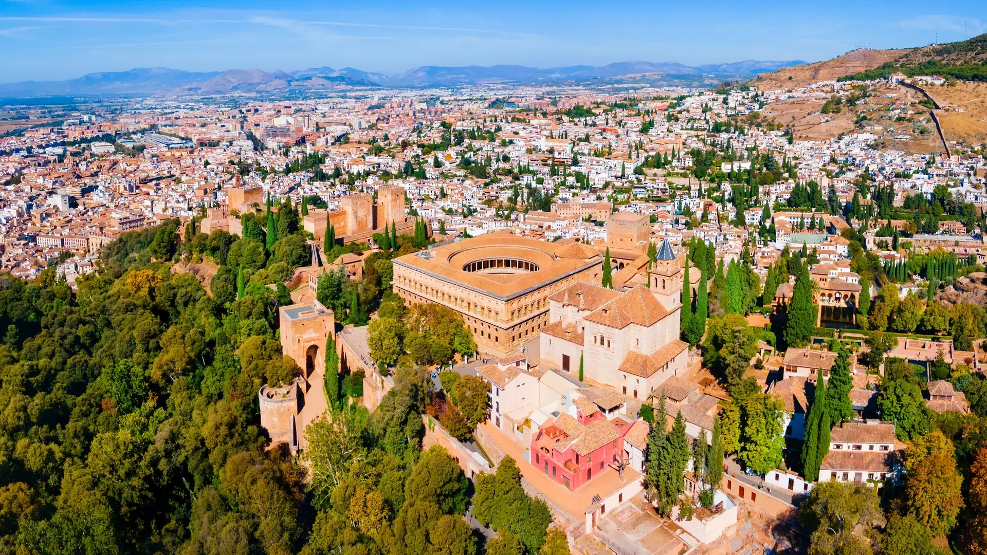 The Alhambra aerial panoramic view. The Alhambra is a fortress complex located in Granada city, Andalusia region in Spain.