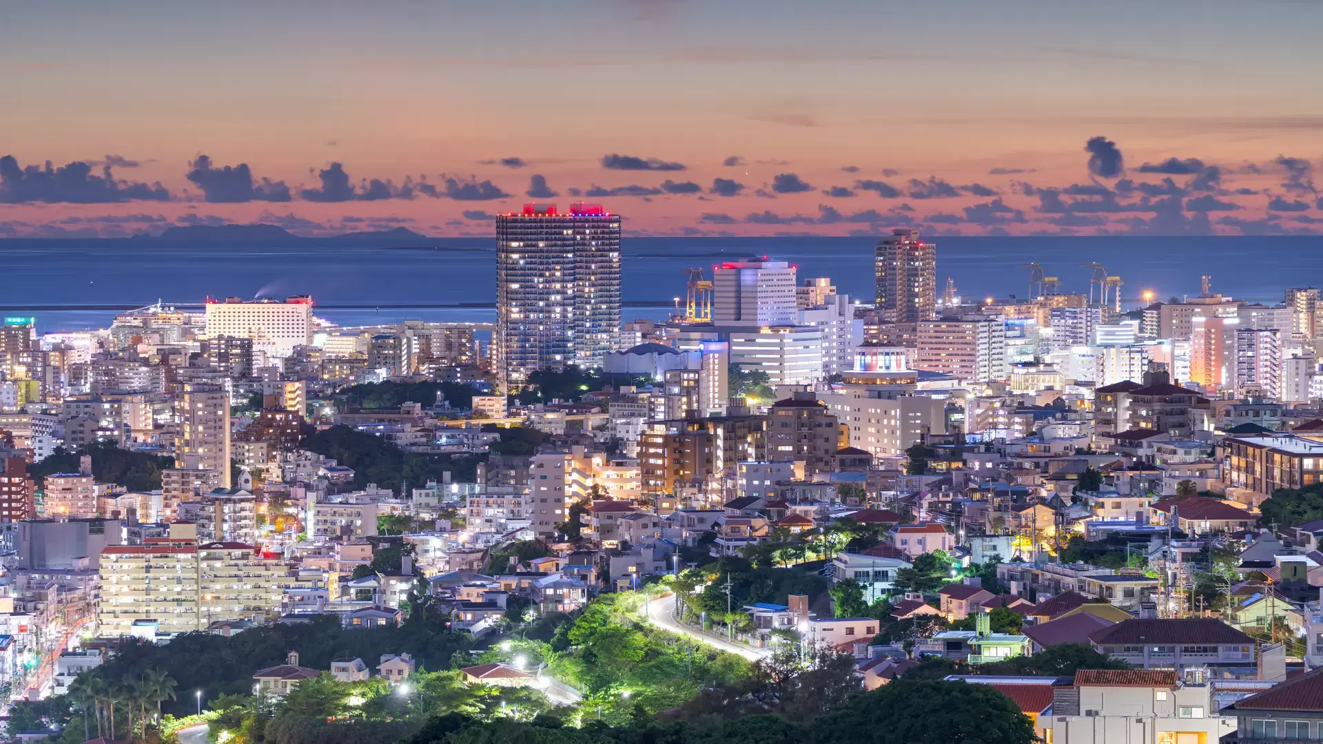 Naha, Okinawa, Japan downtown city skyline at dusk.