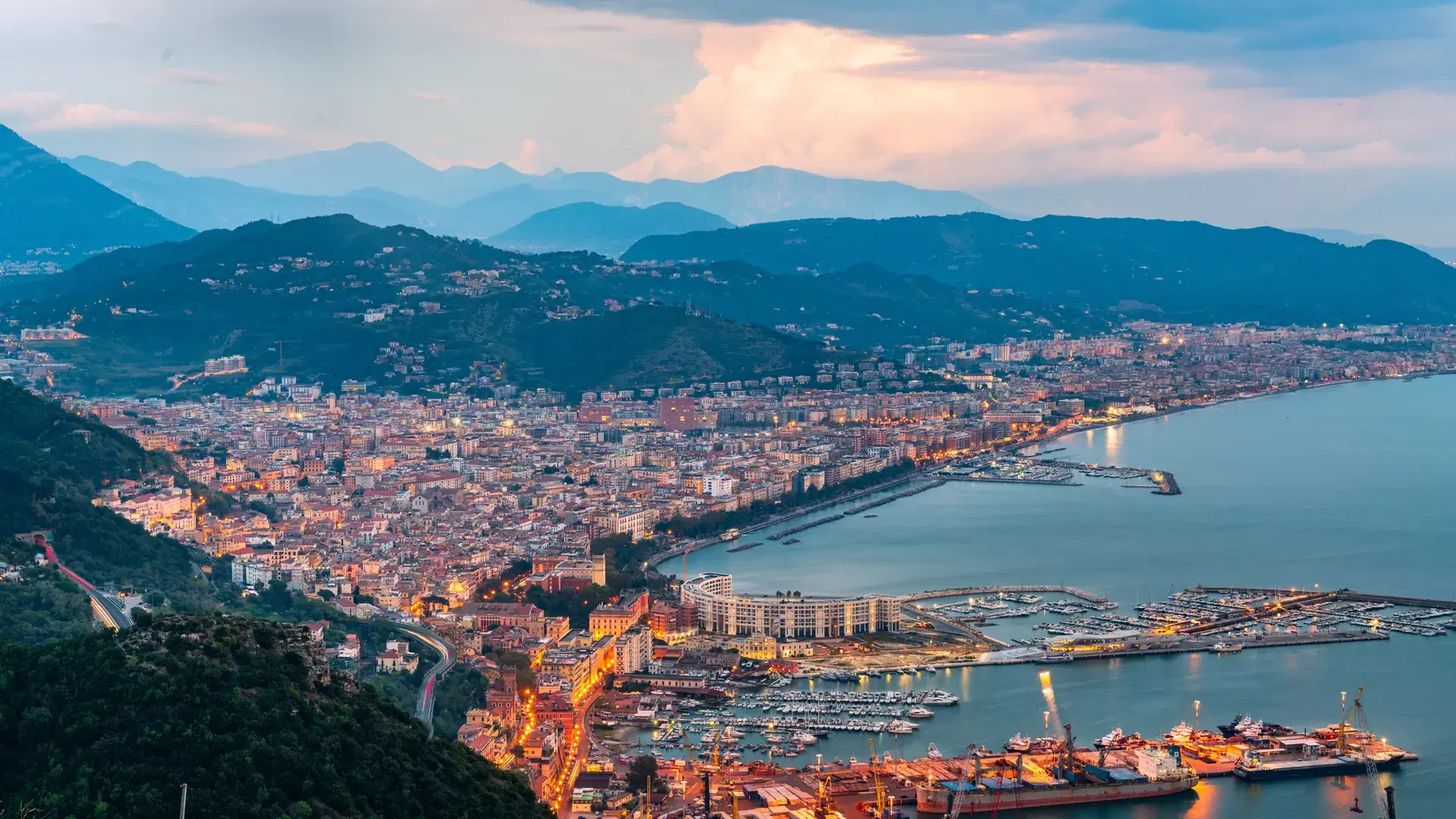 Salerno, Italy on the Mediterranean Coast at dusk.