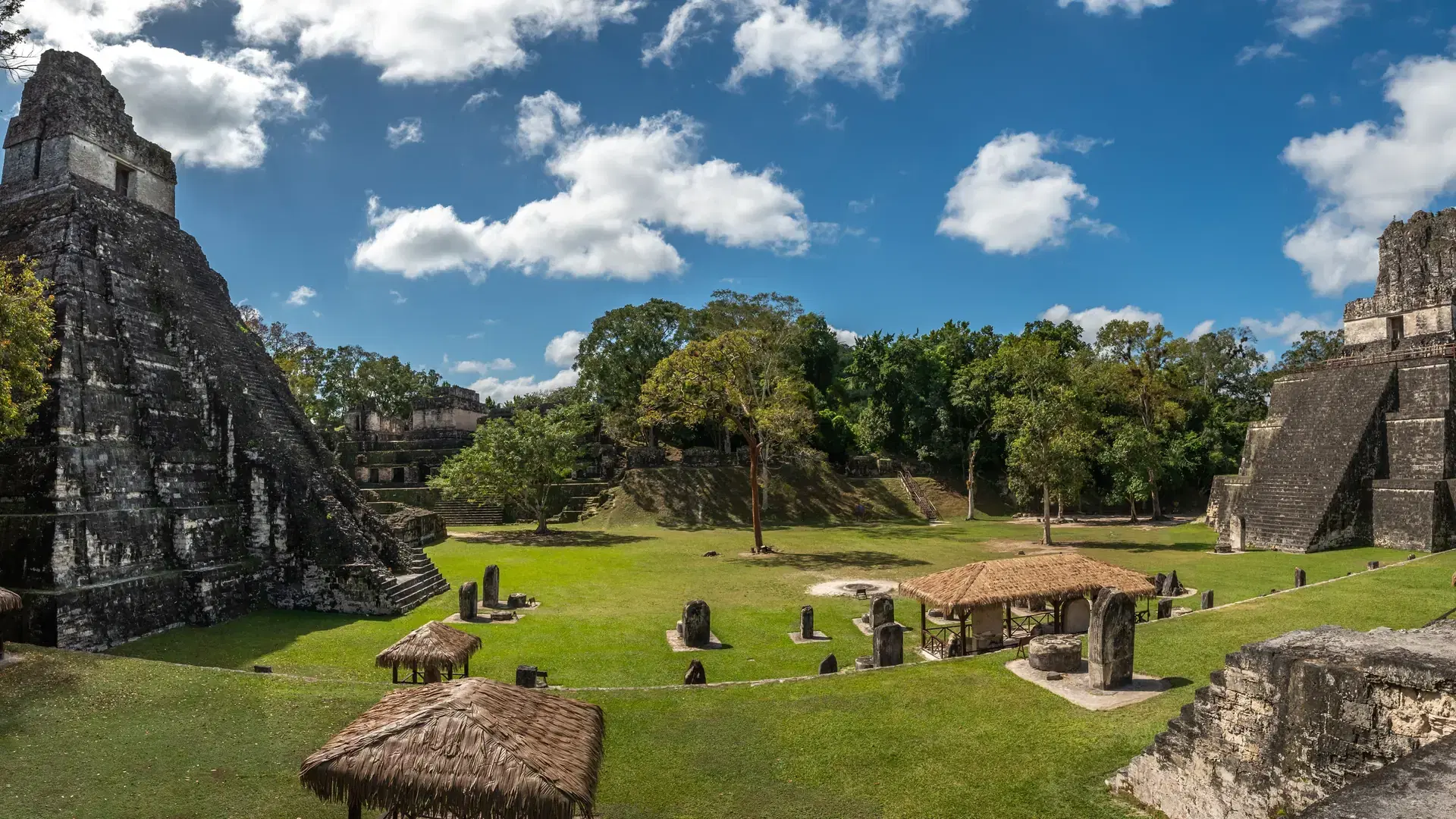 This stunning landscape captures the majestic Maya ruins of Tikal Flores in Guatemala
