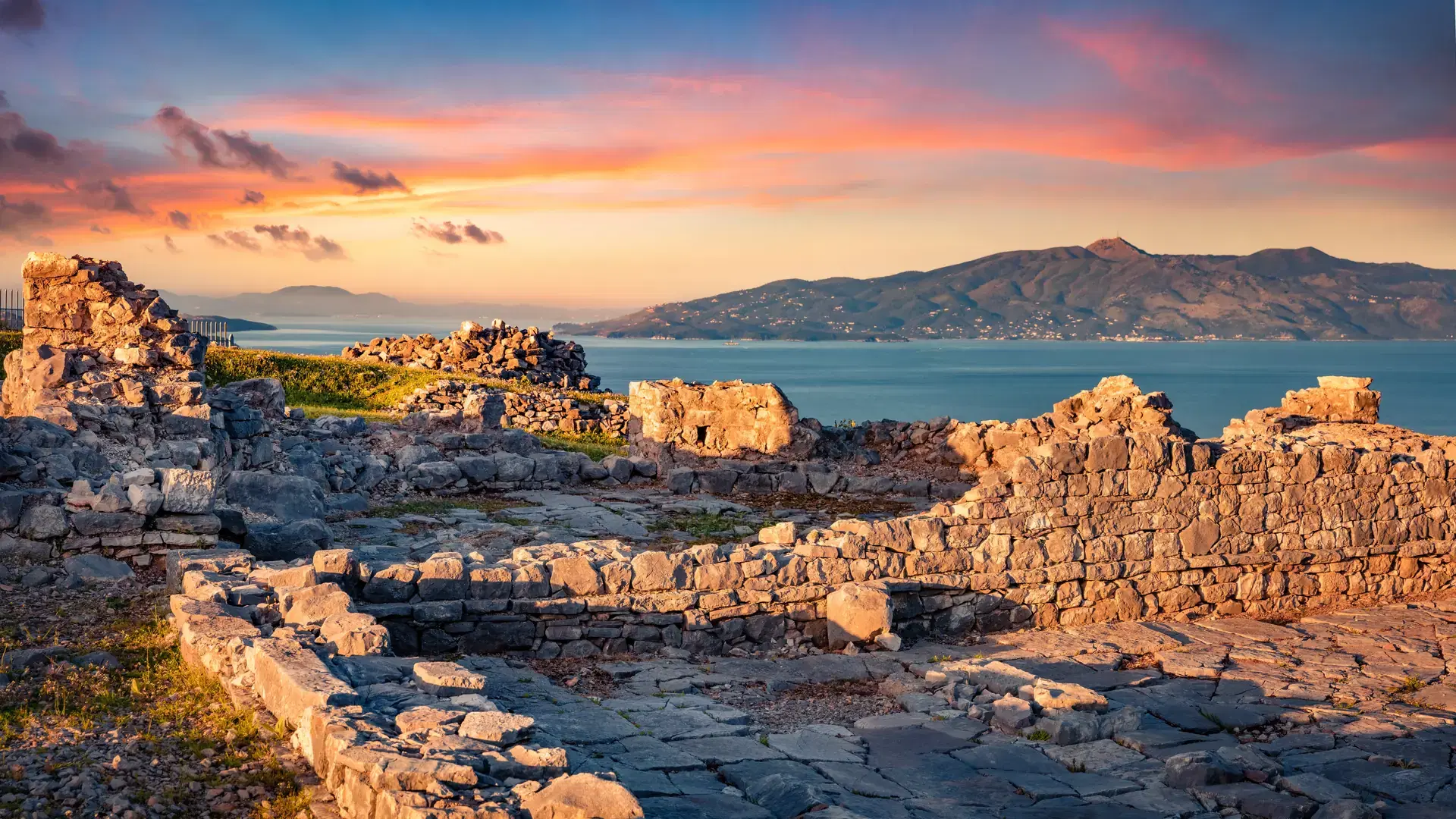 Impressive morning view of ruins of Lekursi Castle in outskirts of Saranda port. Picturesque sunrise on Mediterranean sea. Nice outdoor scene of Albania, Europe. Traveling concept background.