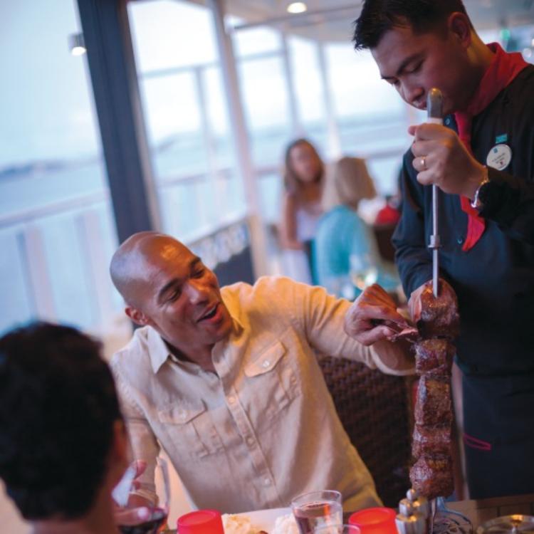 Waiter shaving meat