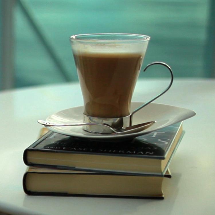 Coffee mug on books
