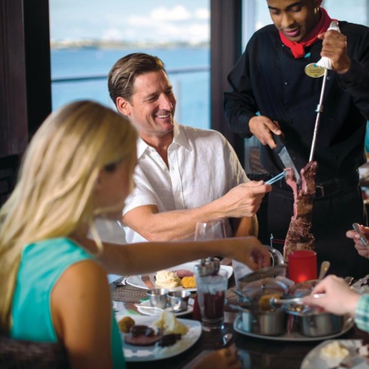 Waiter shaving meat