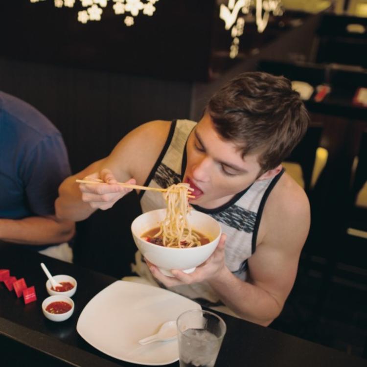 Guest eating noodles