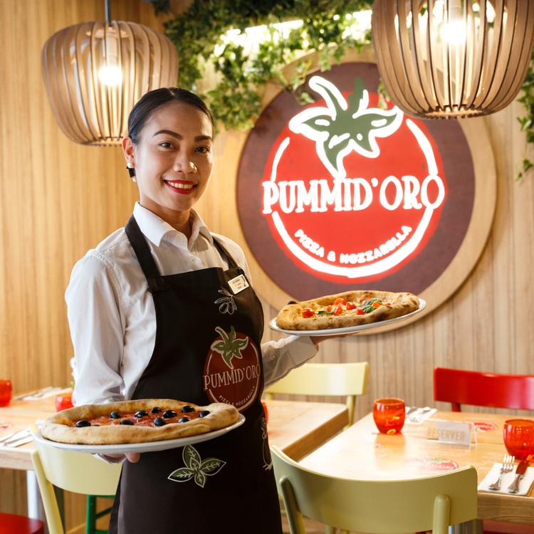 Waitress holding Pizza