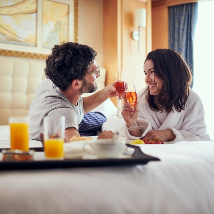 Couple Eating in Bed