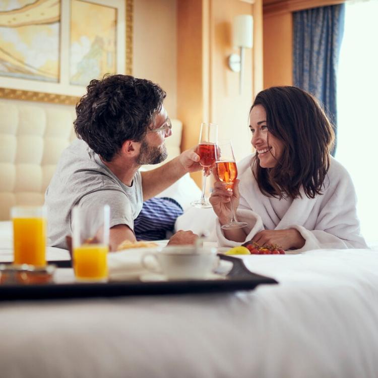 Couple dining in bed