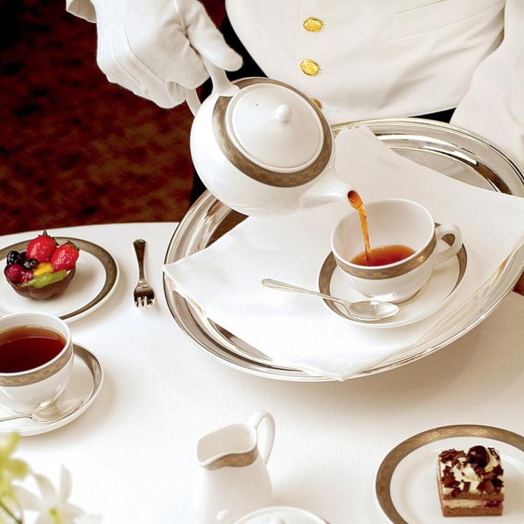 Waiter Pouring Tea