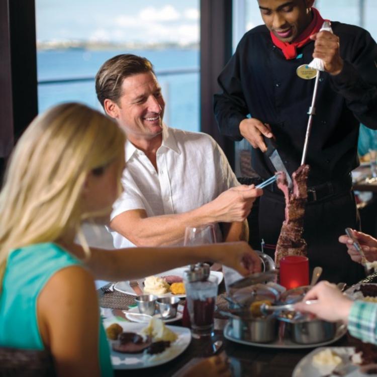 Waiter shaving meat