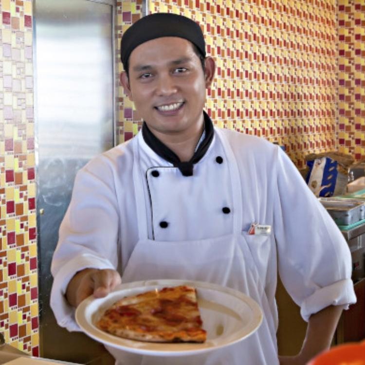 Serving pizza