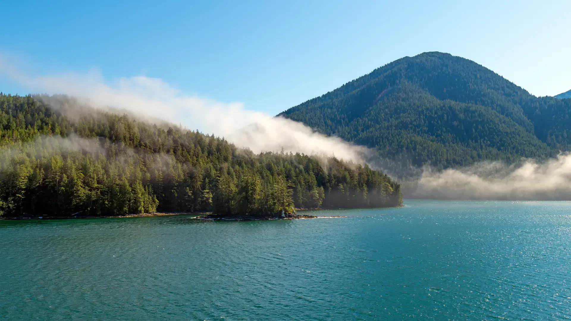 Landscape along Inside Passage cruise with mist and fog between Prince Rupert and Port hardy, Vancouver Island, British Columbia, Canada.