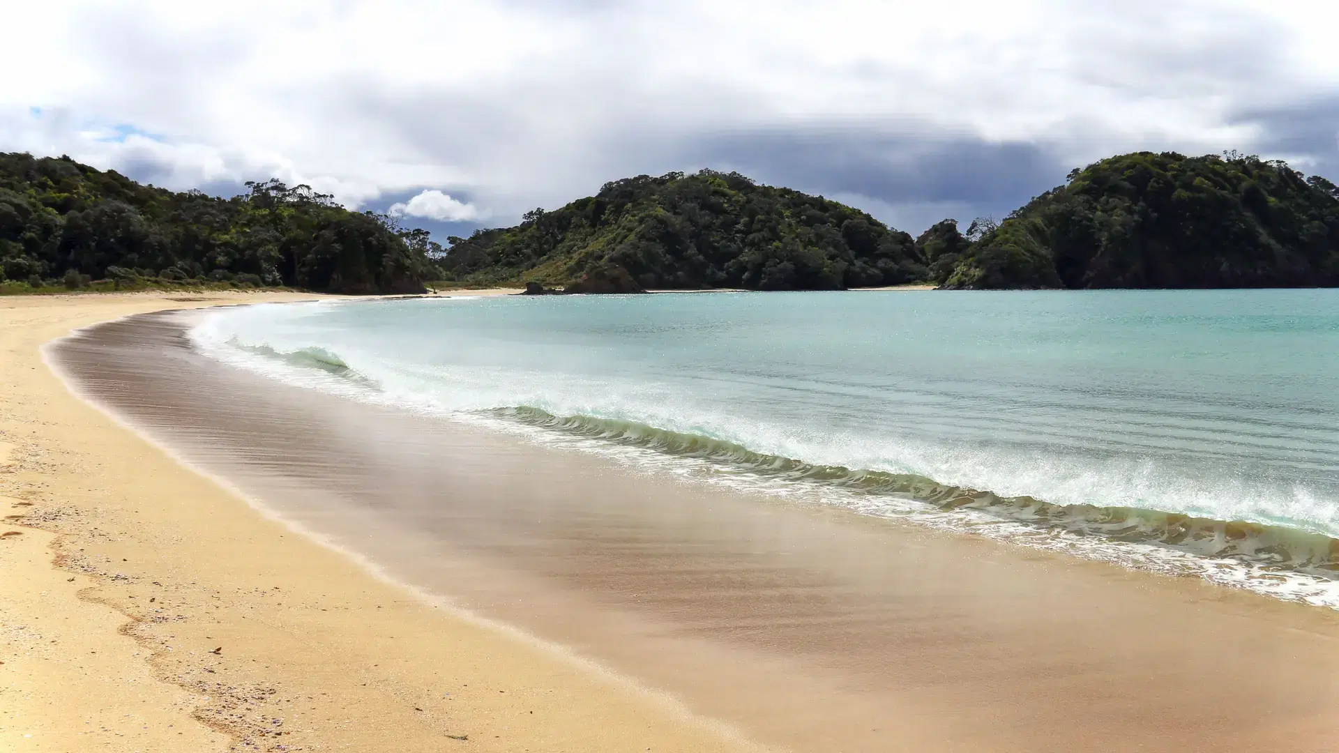 The Bay of Islands in New Zealand with its pristine white sand and clear blue water