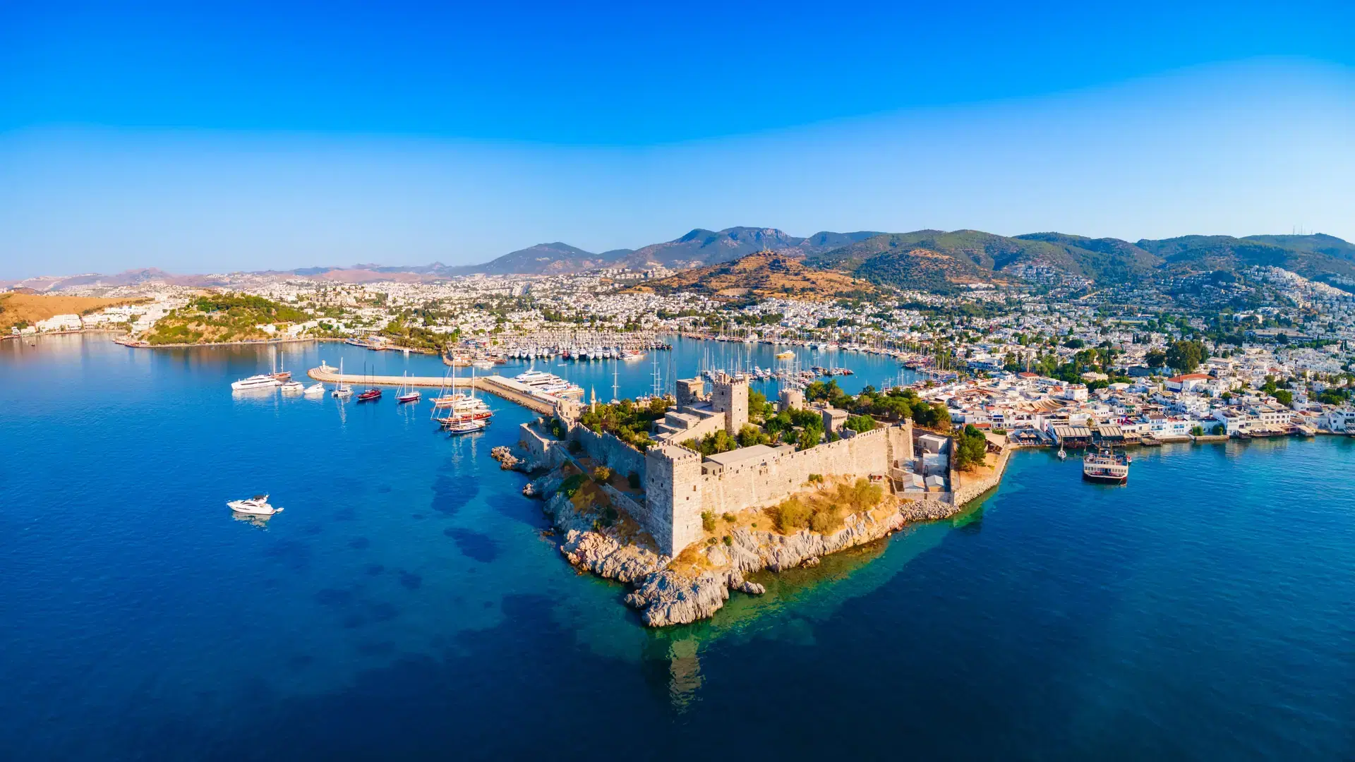 The Bodrum Castle of St. Peter and marina aerial panoramic view in Bodrum city. Bodrum is a city in Mugla Province, Turkey.