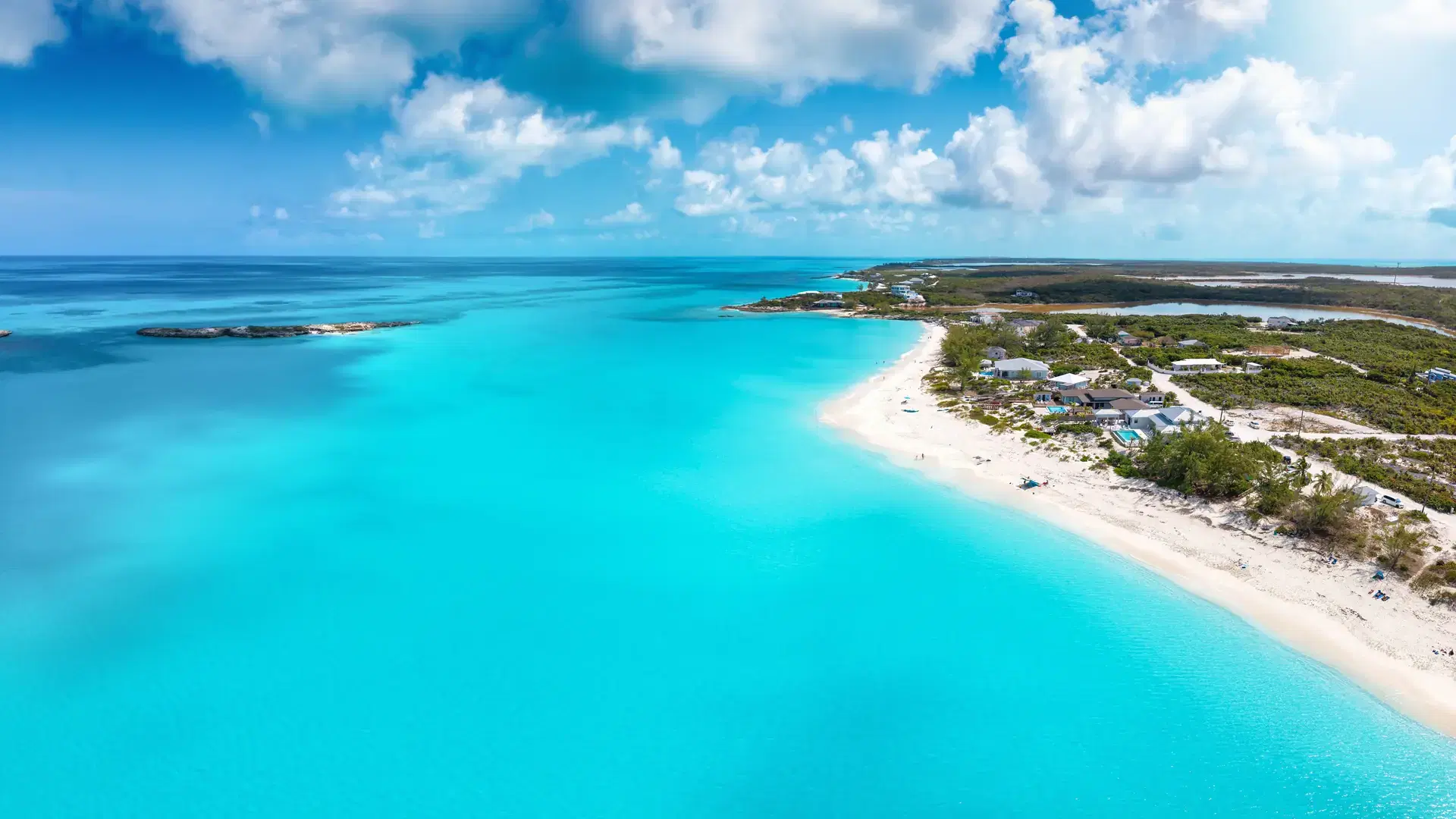 Panoramic aerial view of the turquoise shining ocean at the beautiful Tropic of Cancer Beach, Little Exuma island, The Bahamas