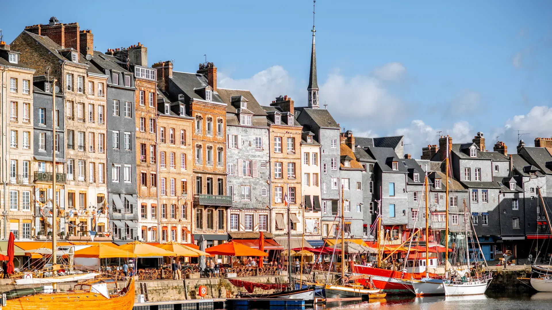 Waterfront with beautiful old buildings in Honfleur, famous french town in Normandy