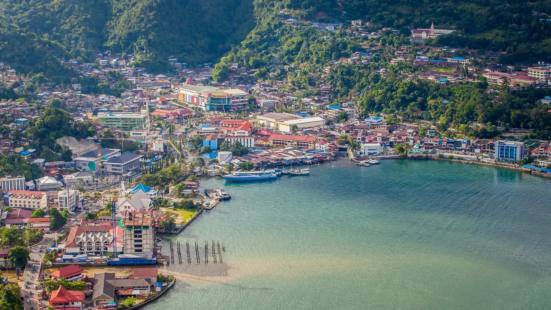 Aerial view of Jayapura city which looks beautiful on the edge of the bay. Jayapura is the capital of Papua Province, Indonesia.
