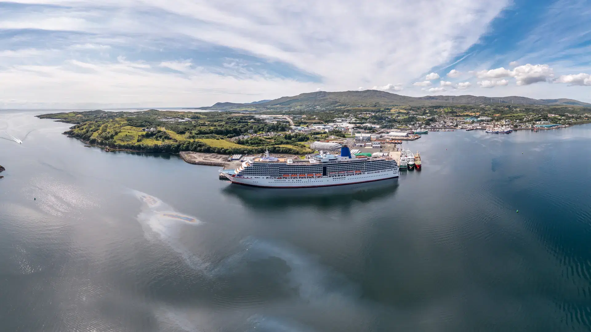 Aerial view of Killybegs with huge cruise ship in County Donegal - Ireland - All brands and logos removed