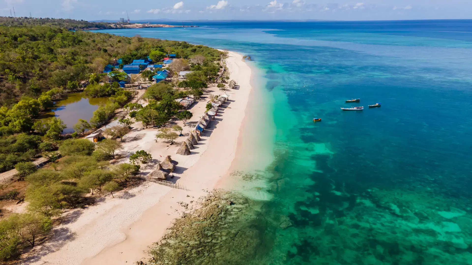 Beautiful view of Tablolong Beach with traditional gazebo, a tropical paradise located in Kupang, East Nusa Tenggara, Indonesia.