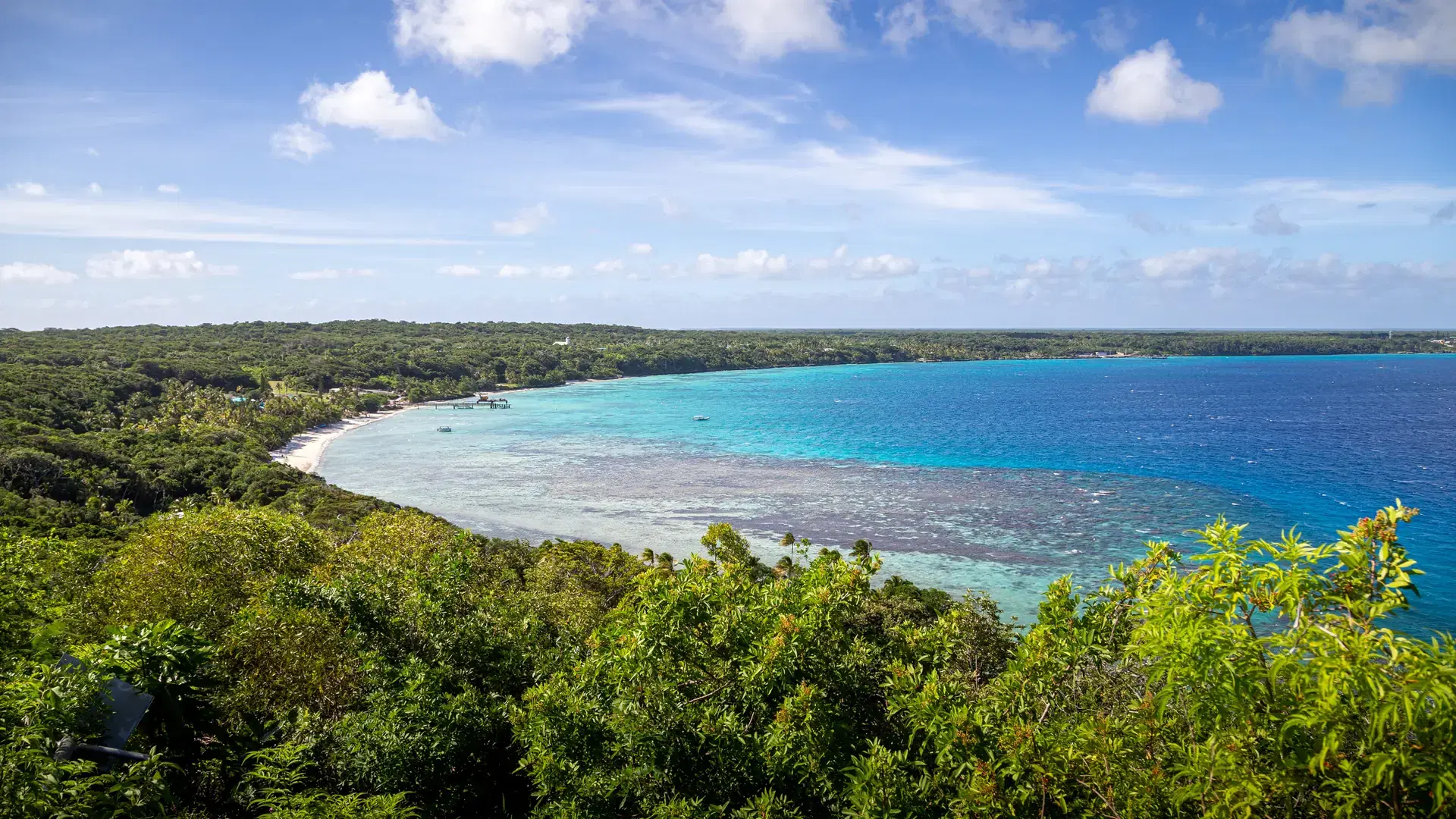 View over the clear white sands and blue waters of Easo Bay on Lifou Island in New Caledonia
