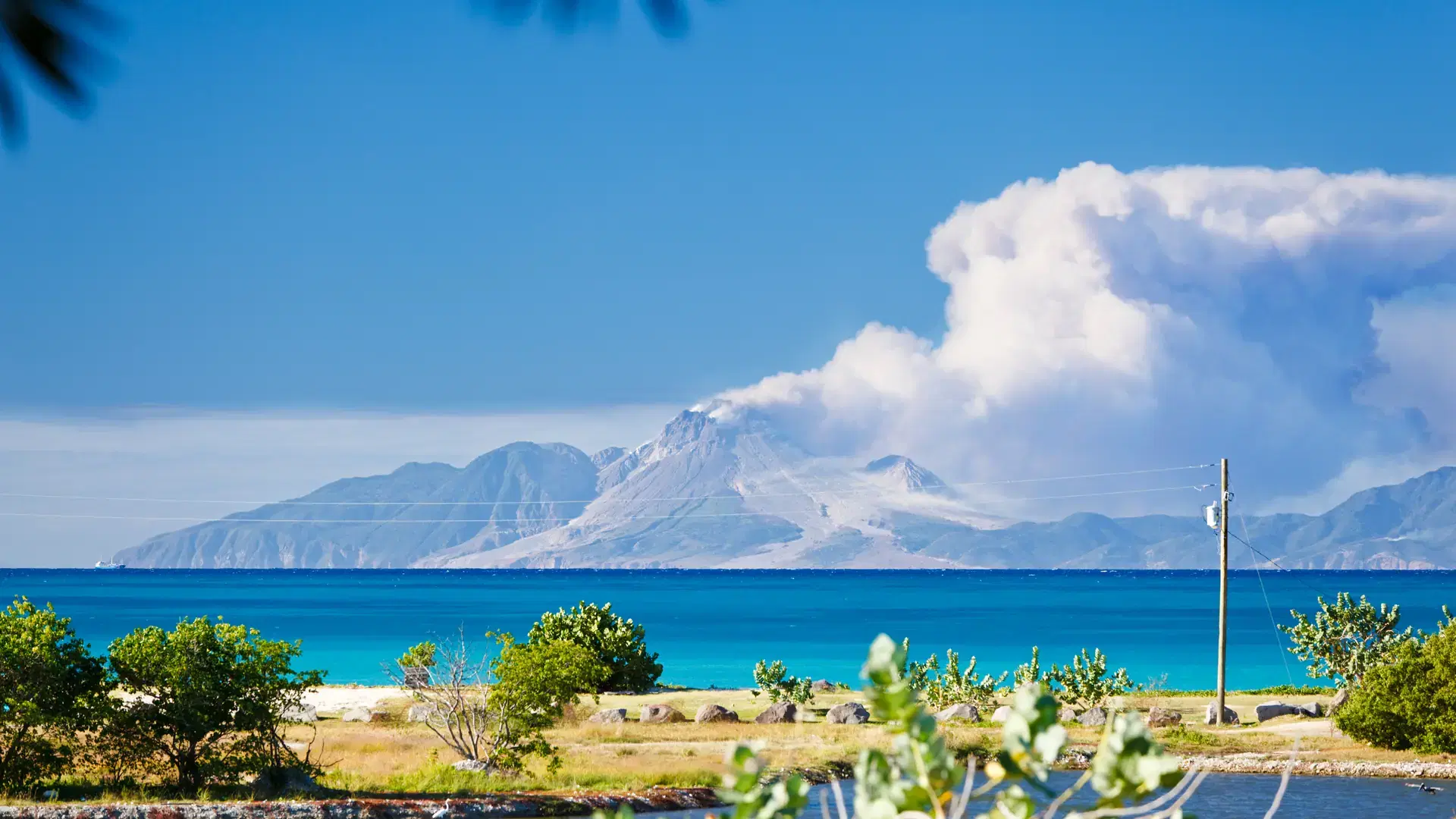 View to the active volcano in Montserrat with a large ash cloud.