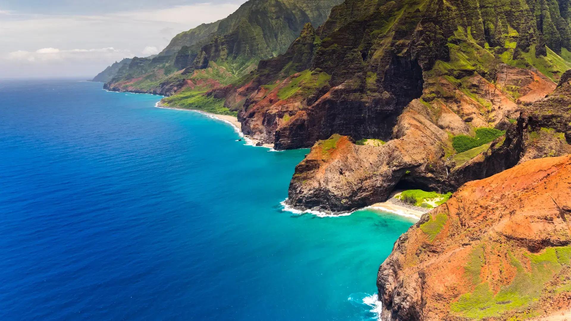 Aerial landscape view of Honopu Arch at Na Pali coastline, Kauai, Hawaii, USA