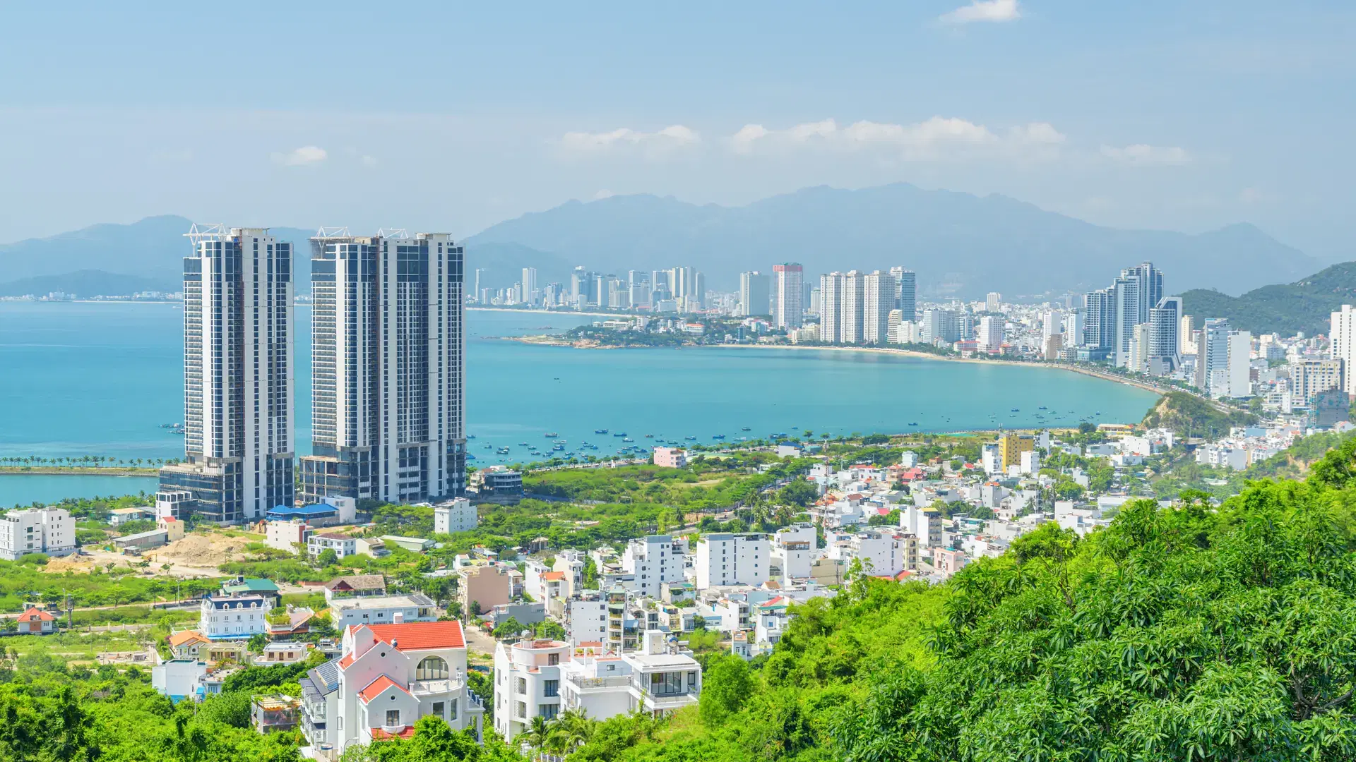 Awesome aerial view of Nha Trang, Vietnam. View from top of a mountain. The coastal city is a popular tourist destination of Asia. Scenic Nha Trang Bay. Wonderful cityscape.