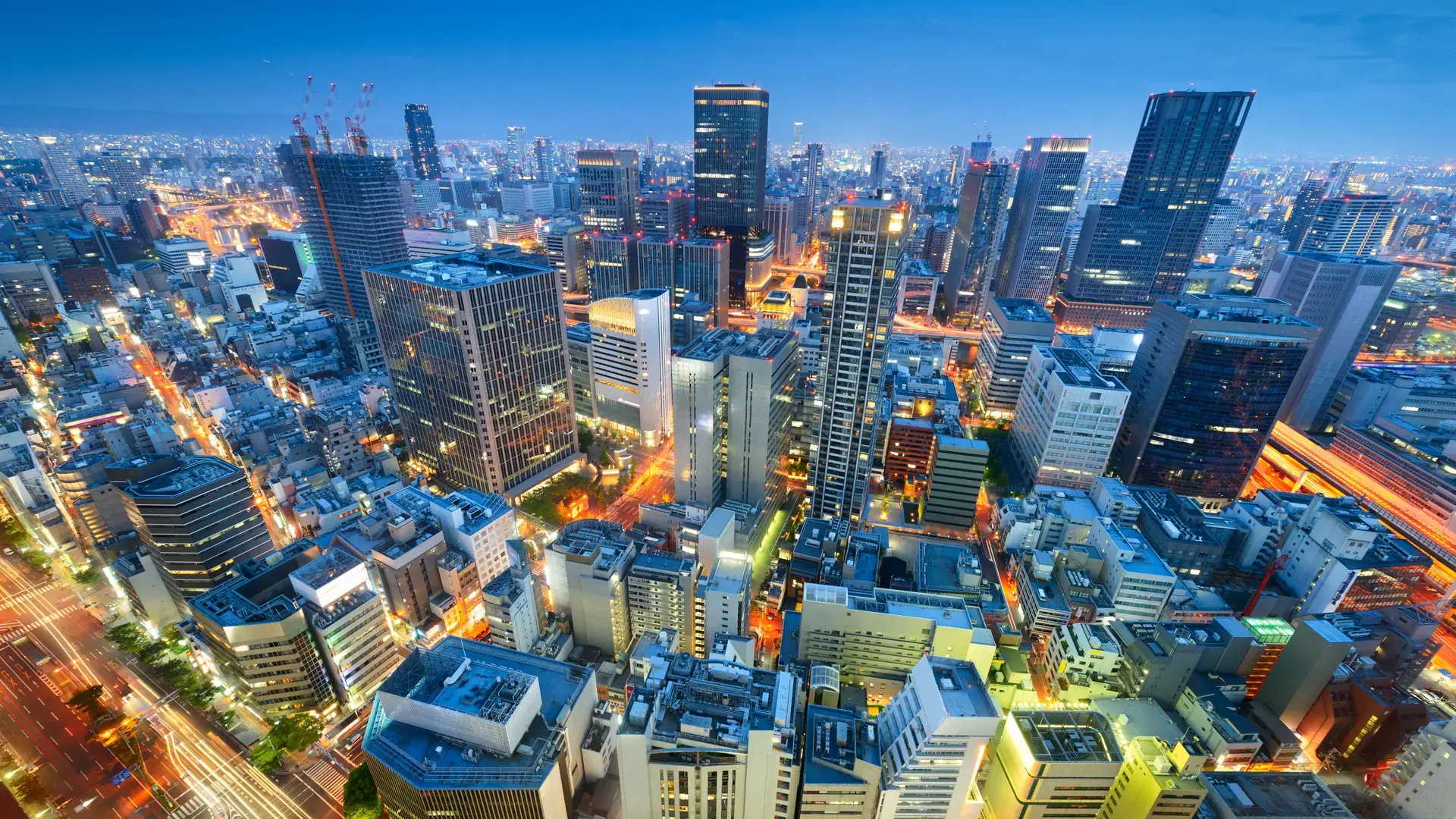 Osaka, Japan downtown city skyline in the Umeda District at dusk.