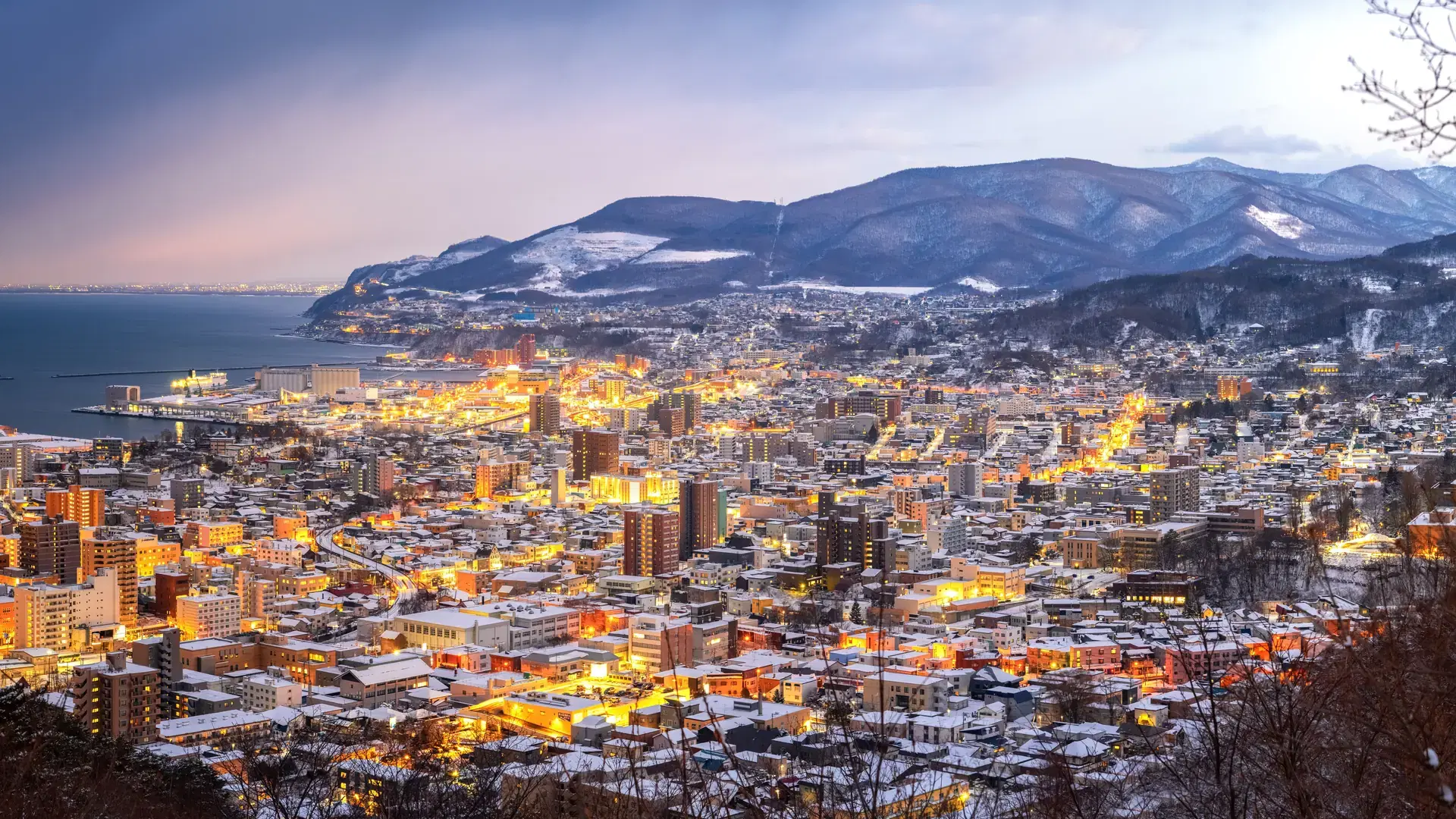 The panoramic view of Otaru with evening illumination. Hokkaido, Japan.