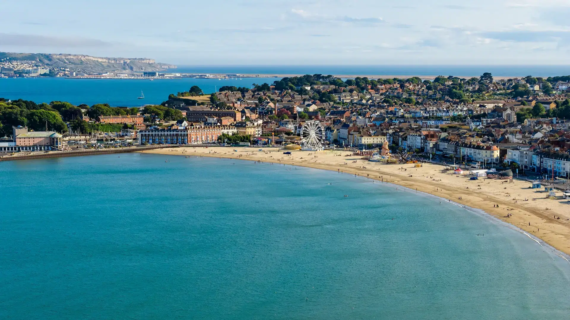 Aerial drone view of Weymouth town and sandy beach on the Dorset coast, England.