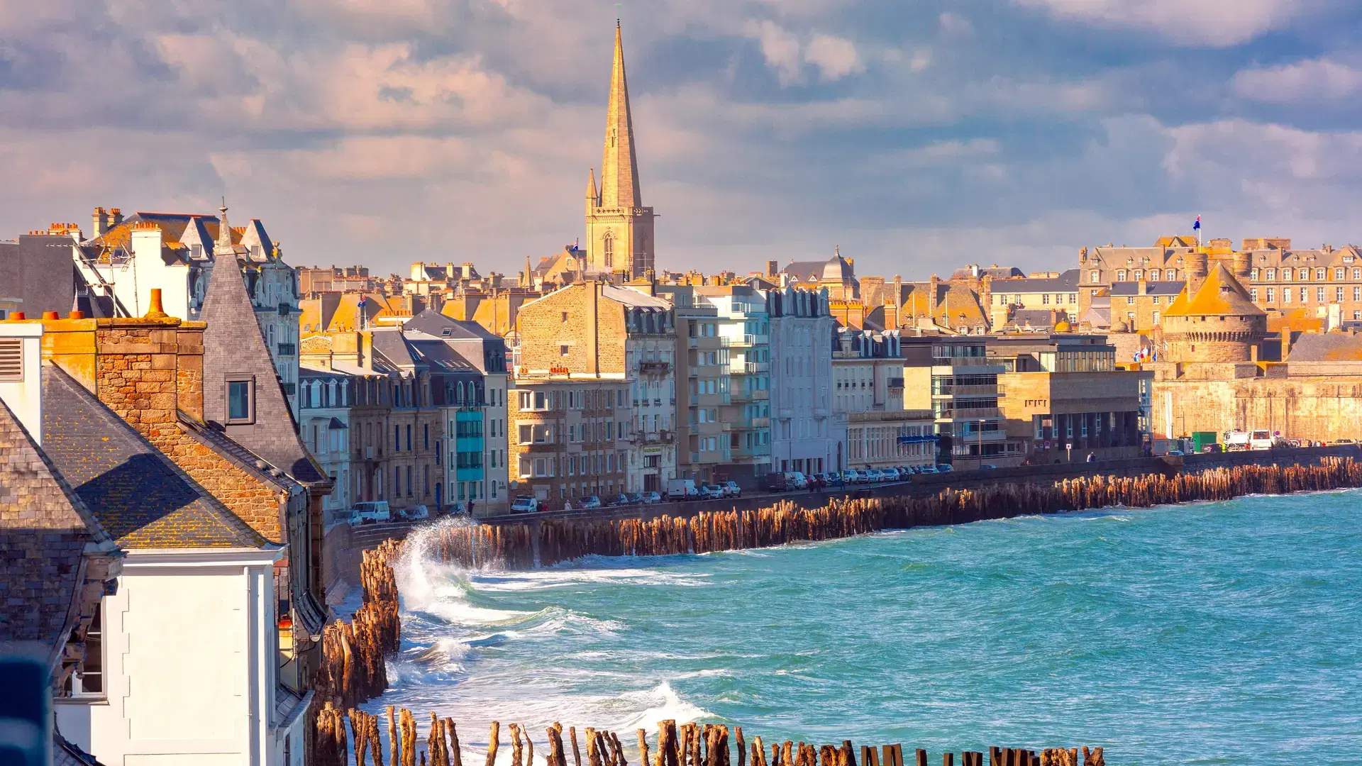 Sunny aerial view of beautiful walled port city of Saint-Malo at high tide, Brittany, France