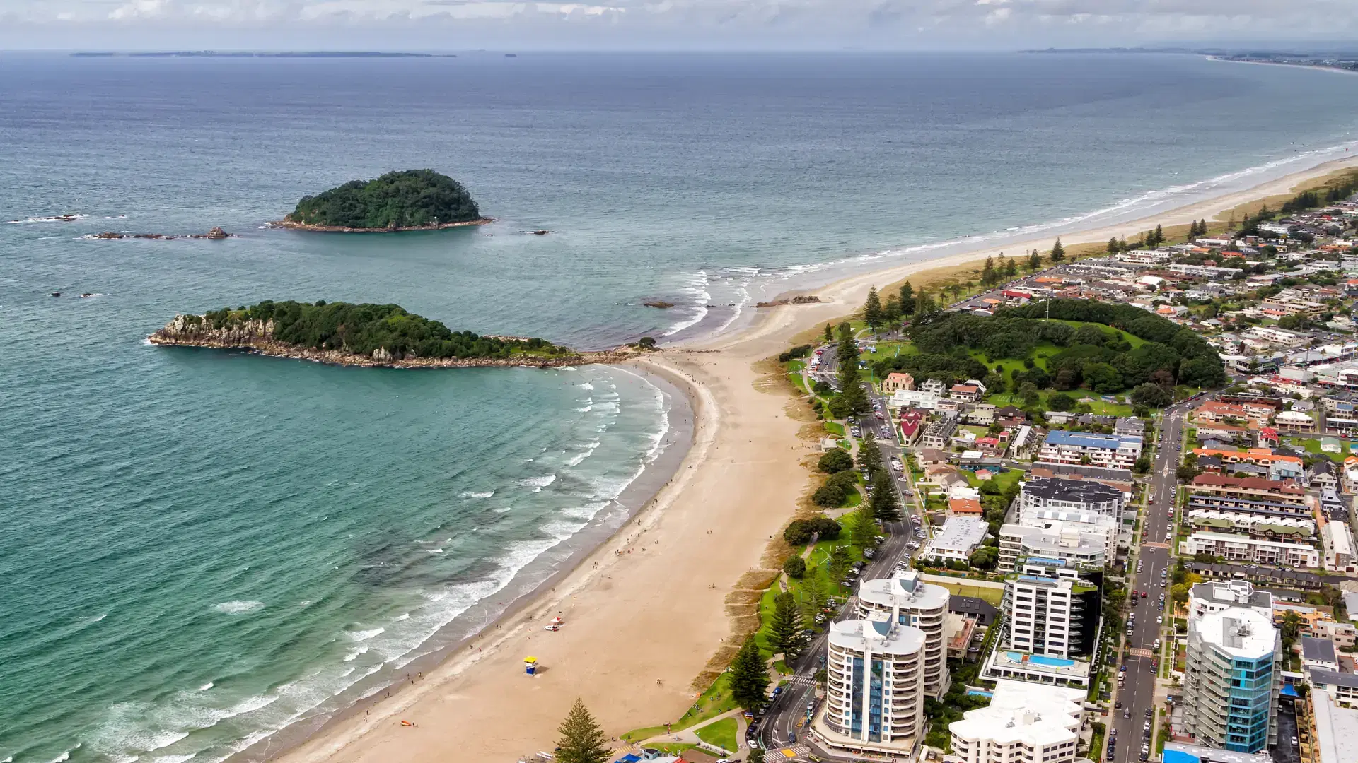 Wide shot view of coast town Mount Maunganui and Tauranga Harbour, Bay of Plenty, New Zealand