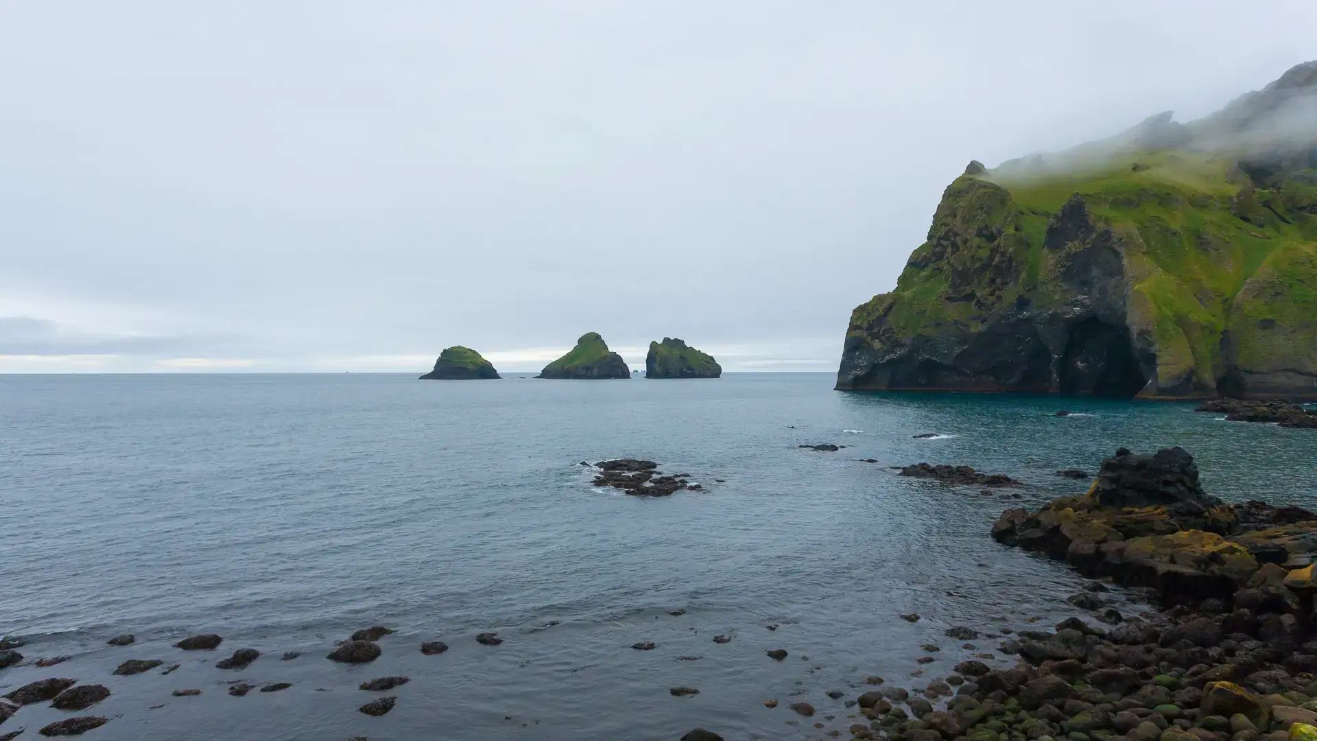 A scenic view of Elephant shape rock on Vestmannaeyjar island beach, Iceland